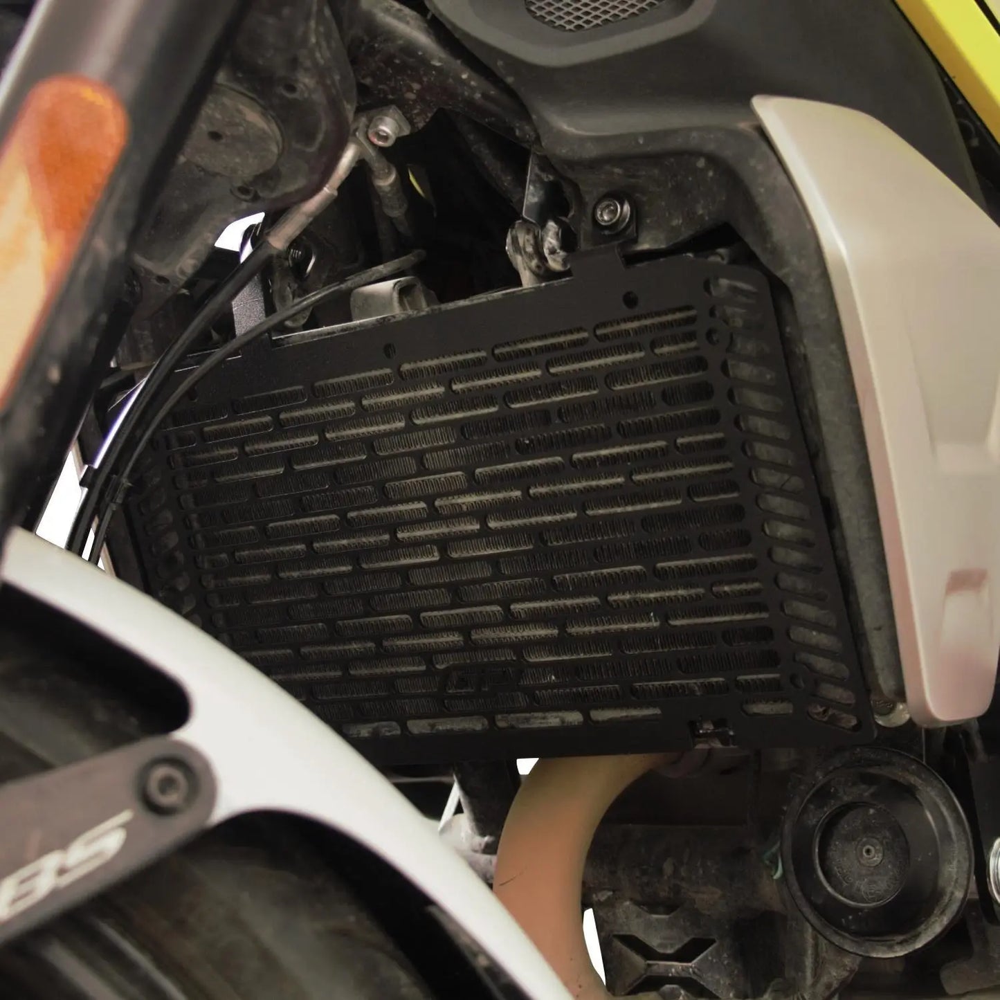 Side view of CFMOTO 250CL-X radiator guard in anodized black